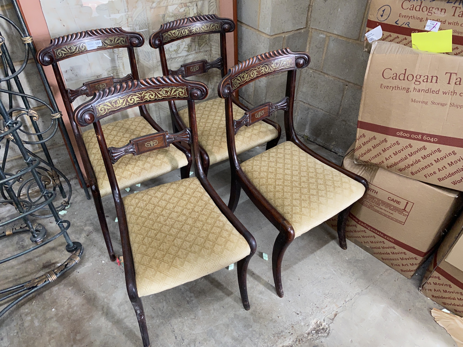 A set of four Regency cut brass inlaid mahogany dining chairs, width 44cm, depth 41cm, height 86cm